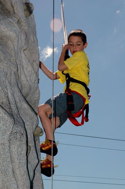 Marysville's Landon O'Neal scales a fabricated rock climbing tower at the second annual Healthy Communities Challenge Day June 5.
