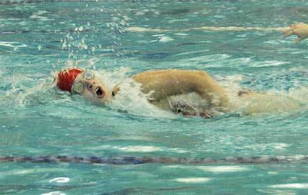 Tomahawk sophomore Karoline Schaufler gasps for breath as she makes her way back toward the starting block in one of her laps of the 500 freestyle.