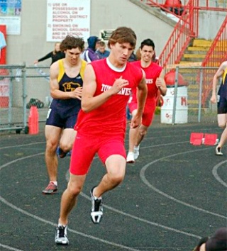 M-P senior Dylan Knudson gets ready for the start of the boys 400. A few lanes back