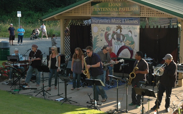 Rock-and-roll band Shameless Hussy performs near the Lions Centennial Pavilion in Marysville's Jennings Park on July 12.