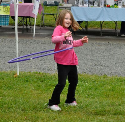 Lyde Callagan hula-hoops during the fourth annual Healthy Communities Challenge Day on June 1 at the Allen Creek Elementary play field.