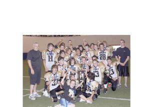 The victorious Marysville Wolverines pose with the championship trophy
