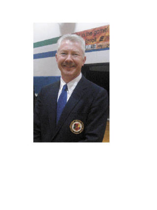 Arlington karate teacher Doug Exum smiles as his students recently competed in the Washington Games at Edmonds Community College.