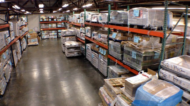 Pallets of Thanksgiving and Black Friday inserts at the Sound Publishing regional press center in Everett.
