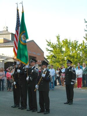 The Marysville Fire District Honor Guard parades the colors in front of the Police and Firefighters Memorial outside of the Marysville Public Library on the morning of Sept. 11