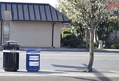 A new recylcing bin has been placed near the street on Fourth Avenue and is hoping to be put to work just like the garbage can next to it.
