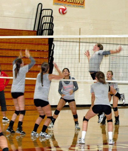 Senior Kate Vavrousek leaps through the air to spike the ball during the Marysville-Pilchuck High School volleyball team’s Aug. 27 practice session.
