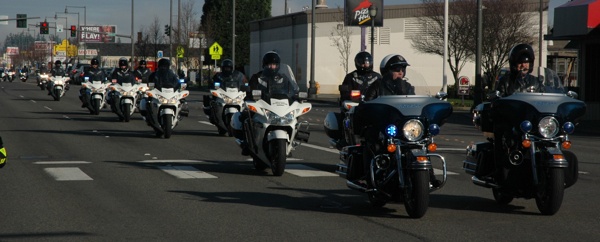 The funeral motorcade for corrections officer Jayme Biendl departs the Schaefer Shipman Funeral Home in Marysville on Feb. 8.