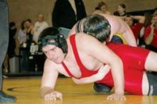 Junior Austin Mathis puts his right hand down in an attempt to steady himself Saturday