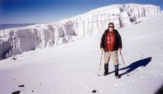 Hiking poles in hand in order to steady his steps