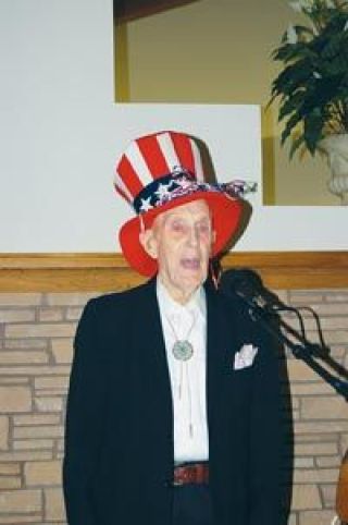 Former Marysville resident Chet Moyer sings God Bless America on his 103rd birthday at Grandview Village