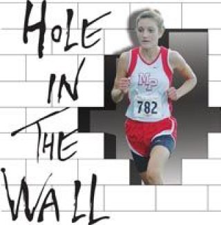Freshman Kaylie Kimmell charges up the hill en route to a second-place overall finish to propel the Lady Tomahawks to a first place victory.