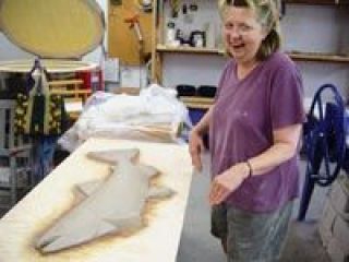 Marguerite Goff builds the maximum size fish that will fit into her kiln while preparing a public art piece for the outside of City Hall. Goffs is one of two commissions from last years Fall into Art Auction.