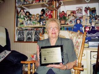 Sitting in the rocker where she produces many of the items she donates to charity