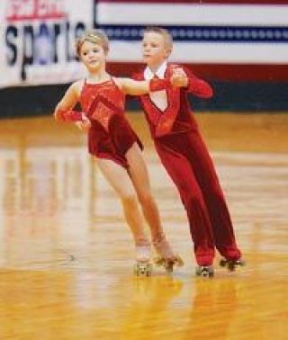 Cidney Evanson and partner Hayden Schmidt compete in the Juvenile Team Dance.