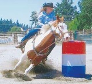 Tiffany Coon rides Blue in the state junior rodeo in Omak Sept. 30 and Oct. 1. Coon has had a successful season in barrel racing and pole bending