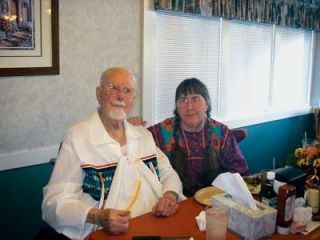 Former Marysville resident Warren Bassham gets ready to cut the cake at his 100th birthday party at the Golden Corral on Oct. 5. They say the first 100 years are always the toughest