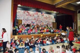 Students take their seats in the Sunnyside Elementary auditorium for a Nov. 9 program honoring military personnel and their families.