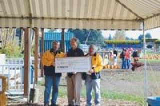 Pumpkins paid off big time last weekend as the Marysville Rotary handed out checks on Oct. 28 to three local school districts to help with reading programs.  The Pumpkins for Literacy patch moved to a new location at the Plant Farm at Smokey Point this October