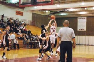 Junior guard Ryan Lanphere goes up for a jumper against Monroe. M-P coach Bary Gould credited Lanpheres defensive performance for creating some crucial fast-break opportunities.