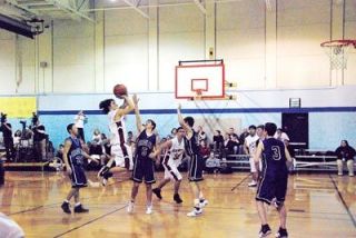 Jordan Wasko of the Tulalip Heritage Hawks shoots during the third quarter to close the 19 to 31 point gap to the Grace Academy Eagles on Dec. 18.