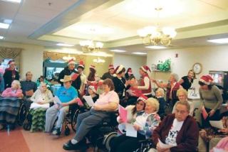 Students from Marysville Mountain View entertain residents of the Marysville Care Center during a caroling visit on Dec. 18. They brought handmade cards to the elderly folks at the Grove Street nursing home for the seventh straight year.