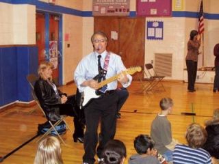Lt. Gov. Brad Owen blasts a few riffs for students at Liberty Elementary.