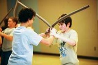 Nick Dominski studies sword fighting in the Everett KIDSTAGE class Acting II  Swords and Swashbucklers. The Lakewood Middle School student plays King Louis in the Village Theatres KIDSTAGE Ensemble production of Disneys The Jungle Book Kids!