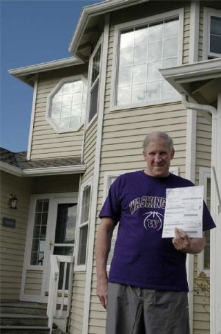 Standing in front of this 103rd Street home