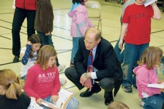 Shayla Wilkinson of Pinewood Elementary School pours over her new dictionary with Marysville School District superintendent Larry Nyland on Feb. 23. Its pretty cool