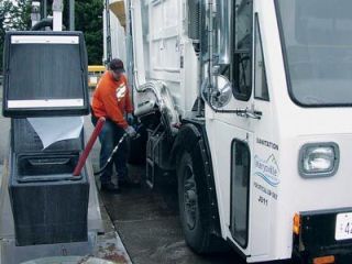 Marysville Solid Waste Collector Travis Ballou pumps biodiesel fuel into a city solid waste truck at the Petrocard facility near the Snohomish County North Transfer Station.