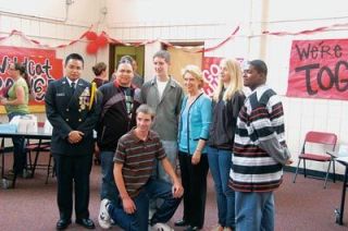 Gov. Christine Gregoire is flanked by Marysville-Pilchuck High School students in the Tomahawk Activities Center during a visit on May 16.  From left are Mike Sales Jr.