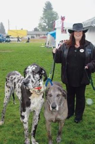 Owner Joanne Graf shows off two of her dogs who vied for Poochapaloozas biggest dog. Security