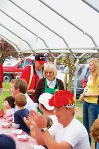 Diana Beringer said there will be one more Pig Out on the Farm next year before she and husband Mike move to new fields in Arlington. Here she is watching the 2007 Slurp-n-Burb contest. They will always be part of the Marysville Strawberry Festival