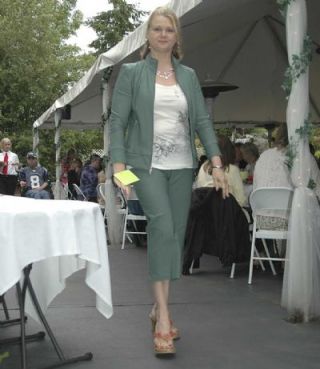 Model April Bagley shows off a matching sage jacket and capri combo.