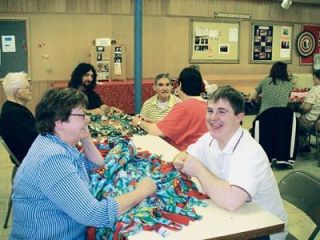 Marysville resident Joseph Tennant helps make blankets for trauma victims at a Quil Ceda Community Services activity session Aug. 9