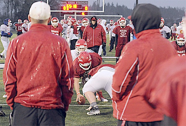 Marysville-Pilchuck's football team goes through the motions during practice before its game against Bellevue Friday night.
