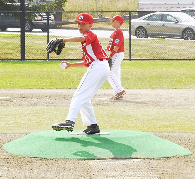 M-Ville's Brad Johnson delivers a pitch.