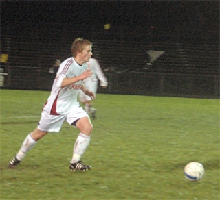 Senior defender Jeff Jensen scans the field for an open teammate.