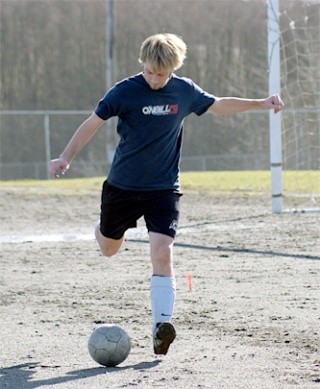 Senior Brian Star kicks a ball around.