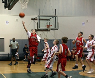 Marysville AAU basketball player Cole Grinde goes for a lay-up.
