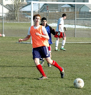 Junior defender Keir Torkkola passes the ball upfield