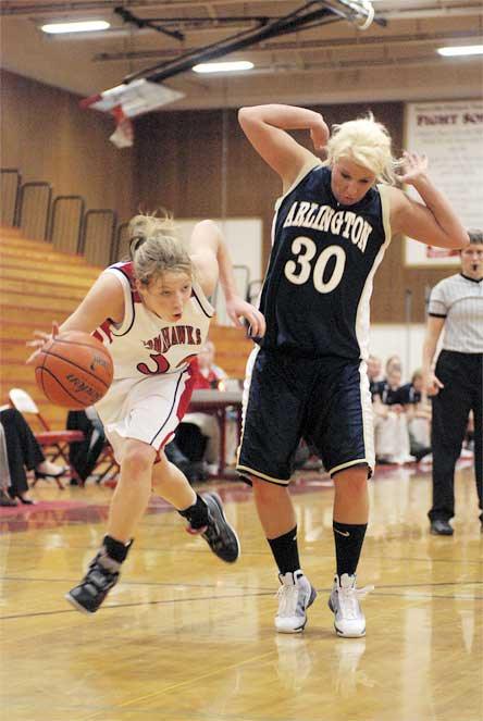 Marysville sophomore Emily Enberg beats defender Tiffany Dagget to the baseline for two of her 13 points.