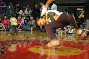 A breakdancer props himself up on one hand during the 360 Break Battle in Marysville on Saturday