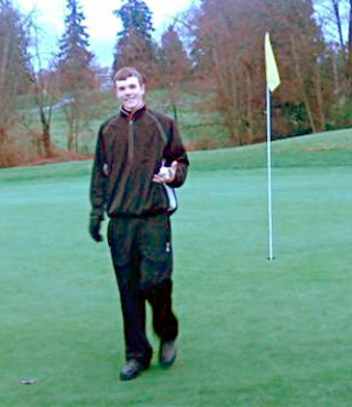 Standing on the green of the 16th hole at Cedarcrest Golf Course