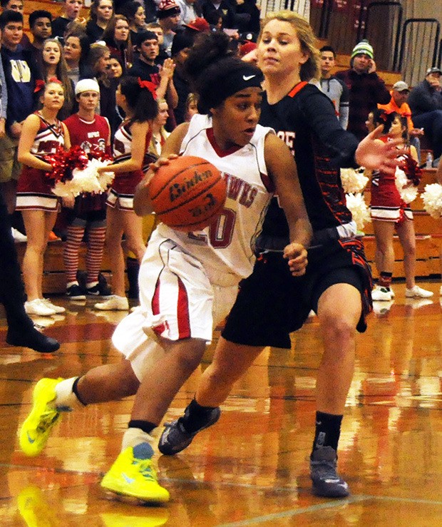 Marysville-Pilchuck's Olivia Lee drives the ball against Monroe opponent.