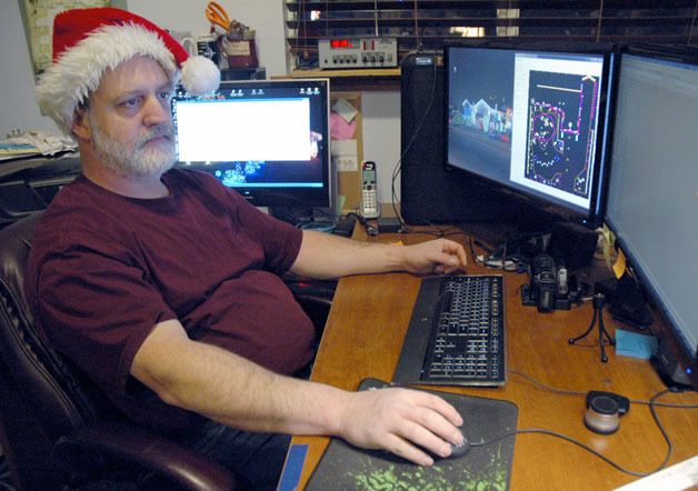 Dennis Warren uses a program called Light-O-Rama to choreograph the flashing of his Christmas lights in time to an entire playlist of music.