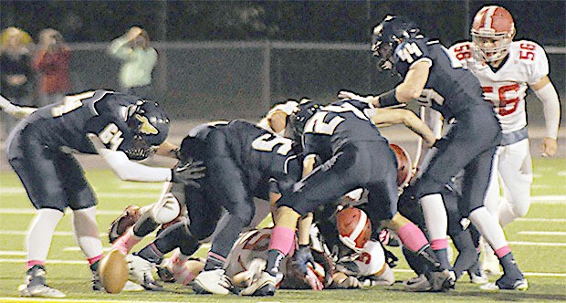 Arlington's defense causes one of many fumbles against Stanwood Oct. 10.