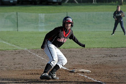Sacha Clow steps off third base to see if the pitch gets away.