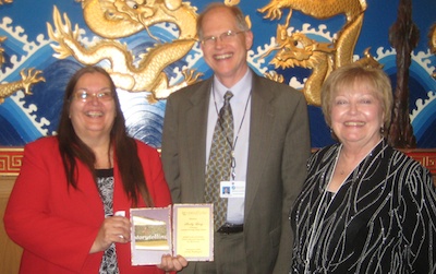 Tulalip Heritage High School Principal Shelly Lacy is joined by Marysville School District Superintendent Dr. Larry Nyland and Assistant Superintendent Gail Miller after being honored by the Northwest Asian Weekly Foundation on Feb. 3.